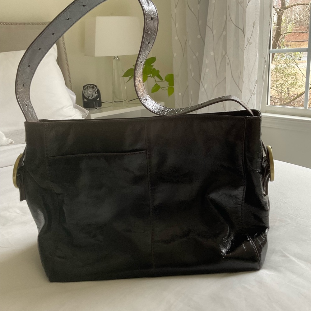 HOBO bag chocolate brown in Italian leather finished with high gloss shine .